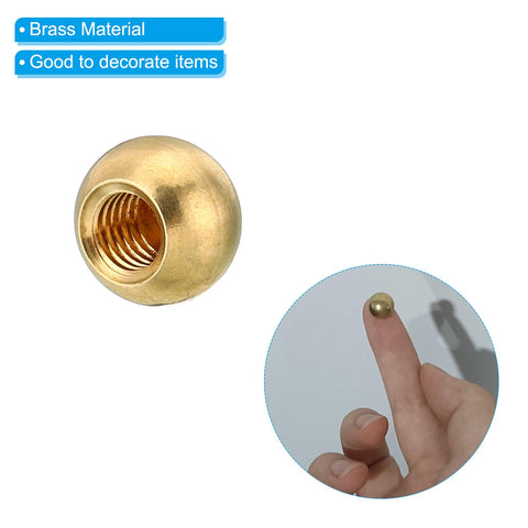 M5x0.8 Brass Ball Cap Nuts, 5 Pack, shown in close-up and on fingertip for size reference, decorative screw caps, 10mm diameter