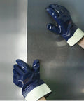 Person wearing Fully Coated Nitrile Work Gloves With 2-1/2 Inch Safety Cuff, Jersey Lined For Comfort, Beefed-Up Abrasion-Resistant Grip