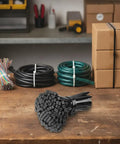 Heavy Duty Self Locking Zip Ties Provide A Rock Solid Nylon Cable Wrap Setup For Electricians With Assorted Sizes In A 100 Piece Fire Resistant Pack on a workbench with organized cords and boxes.