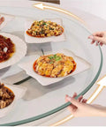 20 Inch Lazy Susan Turntable With Tempered Glass Transparent Rotating Serving Tray displaying dishes on dining table