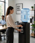 5 Gallon Water Bottle With Easy Grip Handle BPA Free Durable Plastic Jug For Top Load And Bottom Load Water Dispensers in office.