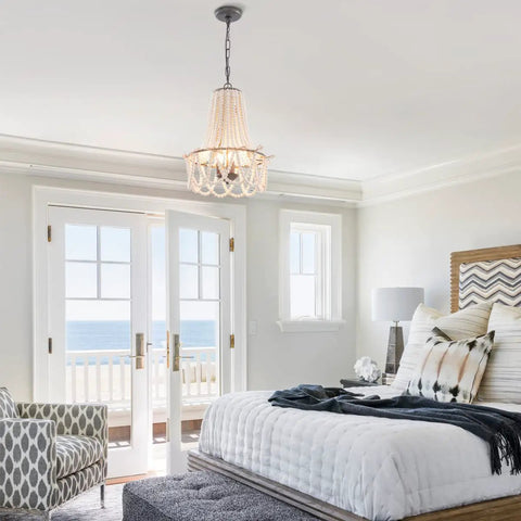 Wood Beaded Chandelier 3 Light Boho Farmhouse Pendant Light Fixture With White Beads And Black Chain in cozy bedroom