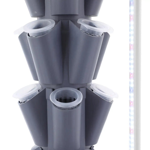 Close-up of grey Vertical Hydroponic Garden Tower With 70 Pods And 14 Tiers, showing planting holes and LED light strip.