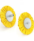 Two buffing wheels with yellow fabric mounted on Four Inch Airway Flange Kit for Angle Grinder with Five Eighth Inch Arbor Hole