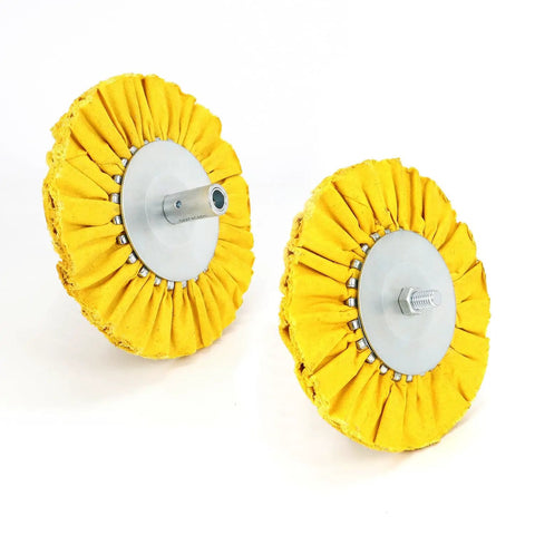 Two buffing wheels with yellow fabric mounted on Four Inch Airway Flange Kit for Angle Grinder with Five Eighth Inch Arbor Hole