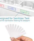 Person holding Restaurant Chlorine Test Strips Value Pack With Instant 1 Second Readout 10 To 250 PPM near a sink.