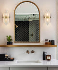 Modern Crystal Glass Wall Sconce Set Of 2 Gold Finish Bath Vanity Lights With Crystal Shade And Back Plate Wall Mount Luminaries For Living Room Bath Soft Warm Ambience Dress Up Your Space, installed in stylish bathroom setting.