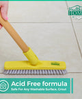 Hand using yellow brush on tile floor with Grout Cleaner Bundle With Grout Brush Pro Grade Deep Clean And Stain Removal label.