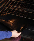 Placing Heavy Duty Grill Mats Set Of 5 Nonstick BBQ Mats For Outdoor Grilling And Indoor Baking Reusable Easy To Clean on an oven rack