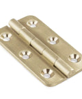 Built Tough 2 Inch Brushed Solid Brass Butt Hinges, showing smooth swivel action and solid construction for door installation.