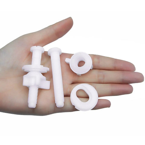 Tough As Nails Universal Plastic Toilet Seat Hinge Screw Bolt Kit components held in a hand, featuring rust-resistant plastic materials.