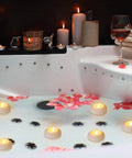 48 Pack Floating LED Candles Water Activated Battery Powered Flameless Flicker Lights For Baby Shower Wedding Home Party Decor Warm White Glow Real Paraffin Wax Safe And Waterproof in bathtub setting with rose petals.