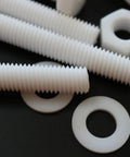 Top Shelf Natural PTFE Hex Head Bolts M10 X 100mm Screw Set Drops Right Into Place With Nuts And Washers on a black background.