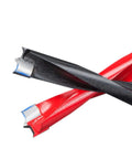 Close-up of two-flute carbide woodworking drill bits; red and black coated bodies