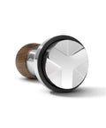 Pro 58 Mm Espresso Powder Distributor With Tough Walnut Handle And Stainless Steel Tines shown at an angle for home barista use.