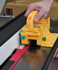 Knuckle Saver 3D Pushblock And One Eighth Inch Grip Leg Combo For Table Saw Safety in use on a table saw with wood strips.