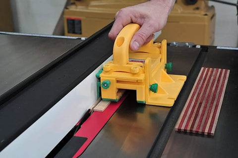 Knuckle Saver 3D Pushblock And One Eighth Inch Grip Leg Combo For Table Saw Safety in use on a table saw with wood strips.