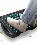 Person using Under Desk Foot Rest For Office And Gaming Chairs Ergonomic Rocking Footstool With Roller Massager feet up comfort