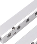 Close-up of Six Way Eight Port Air Compressor Manifold Block With 1/4 Inch NPT Output And 1/2 Inch NPT Supply Port For Pneumatic Systems.