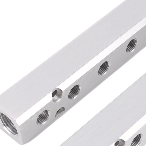 Close-up of Six Way Eight Port Air Compressor Manifold Block With 1/4 Inch NPT Output And 1/2 Inch NPT Supply Port For Pneumatic Systems.