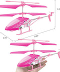 Pink RC Helicopter For Kids And Beginners 2.4GHz 3.5 Channel Indoor Flight Toy With LED Lights shown in hand for scale.