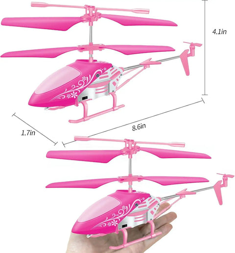 Pink RC Helicopter For Kids And Beginners 2.4GHz 3.5 Channel Indoor Flight Toy With LED Lights shown in hand for scale.