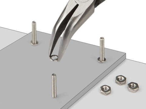 Needle nose pliers from Six-Piece Tiny But Mighty Mini Pliers Set for precision work with nuts and bolts on gray surface.