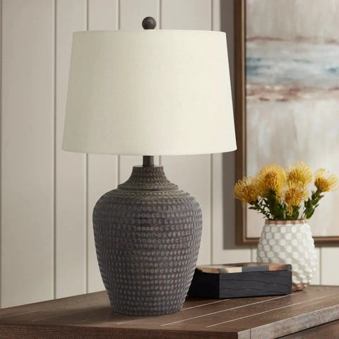 Textured Dot Jug Table Lamp With Dark Brown Finish Cast Resin Construction Oatmeal Linen Round Drum Shade Top 13 Inches