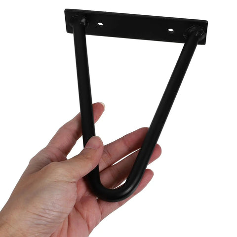 Hand holding a Black Iron Hairpin Table Leg from 2 Pack, Heavy Duty Easy Install Metal Furniture Legs for Coffee Tables, Desks, Benches.