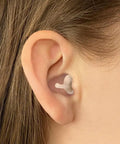 Calmer Kids Ear Plugs For Noise Relief And Focus No Muffling Reusable Soft Silicone Comfortable All Day Wear inserted in ear