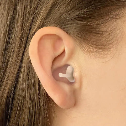Calmer Kids Ear Plugs For Noise Relief And Focus No Muffling Reusable Soft Silicone Comfortable All Day Wear inserted in ear
