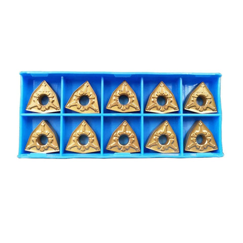 Ten triangular WNMG080404-CM carbide turning inserts in a blue storage tray.