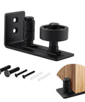 Sliding Barn Door Floor Guide With Adjustable Roller Wall Mount Eight Assembly Options Flush Bottom Design Black Finish Built Tough Carbon Steel Track And Nylon Roller System For Quiet Smooth Everyday Use, showing black metal floor guide with screws and door illustration.