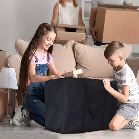 Children packing books into Extra Large Moving Bags With Strong Zippers And Handles For Clothes Storage And Moving, 90 Liter size, indoors