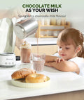 Child watching chocolate milk being poured next to 4 In 1 Barista Quality Electric Milk Frother And Steamer With 16.9 Ounce Capacity 600W Power