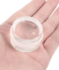 Clear silicone furniture accessory in hand, part of Two Pack Silicone Door Stopper Wedges To Prevent Finger Injuries And Door Slams Sturdy Furniture Accessories
