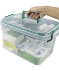 Clear Storage Box With Removable Divider Tray For Easy First Aid And Medicine Organization in hand, showcasing transparent design and contents.