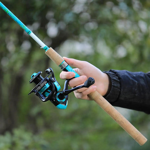 Person holding Solid Spinning Fishing Rod And Reel Combo 5 Feet 6 Inches 2 Piece Graphite And Fiberglass Rod With Durable Build And Quickset Anti Reverse Reel 1 Pack Perfect For Beginners And Pros against green background