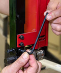 Using a 22-piece hex key from the Long Ball End Hex Key Wrench Set With T Handle for mechanical work on machinery.