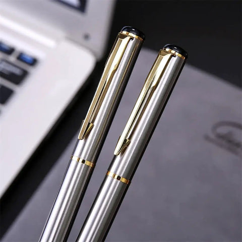 Stainless Steel Golden Rollerball Pen With Smooth Ink Flow And Comfortable Grip on a desk setup