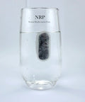 Charcoal Water Filter Replacement For BrewSense Drip Coffee Makers immersed in water displaying filtration process.