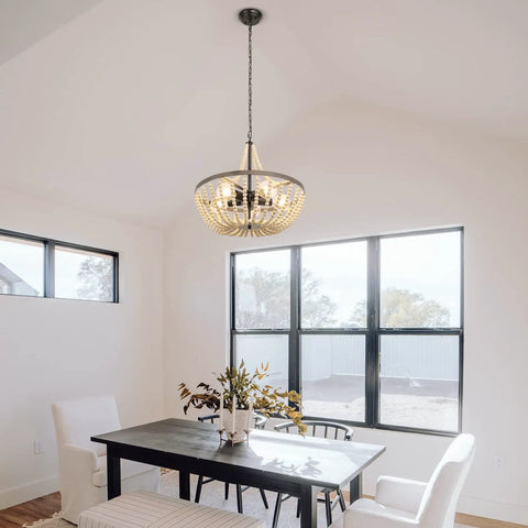 Room with Boho Wood Bead Chandelier With Five Lights And 20 Inch Diameter, Rustic Farmhouse Ceiling Pendant over dining table.