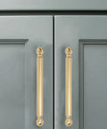 Champagne Bronze Solid Cabinet Pulls Set Of Ten, 5 Inch Center To Center Heavy Duty Cabinet Handles installed on gray cabinet doors