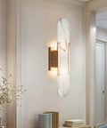 Backplate Sconce With Alabaster Shade Modern Bathroom Wall Light installed on a cream wall, showcasing sleek design and thick backplate.