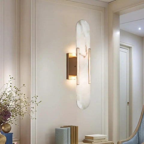 Backplate Sconce With Alabaster Shade Modern Bathroom Wall Light installed on a cream wall, showcasing sleek design and thick backplate.