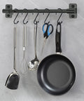 12 Pack Four And A Half Inch Vinyl Coated S Hooks Heavy Duty Non Slip Closet Hooks hanging utensils and a pan on a kitchen rod