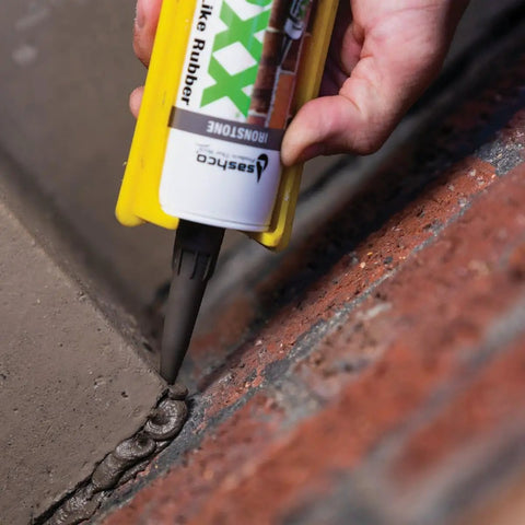 Applying Mor-Flexx Gray Acrylic Latex Caulk For Mortar, Stucco, And Grout Repair on brick surface using a caulk gun