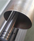 Close-up of 3 In 1 Sheet Metal Cutter, Brake And Slip Roll for 30 Inch 20 Gauge Fabrication, showing metal rolled on machine.