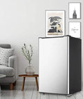 Sleek 3.2 Cu Ft Upright Mini Freezer With Adjustable Removable Shelves And Dope Silver Cabinet in modern living space.