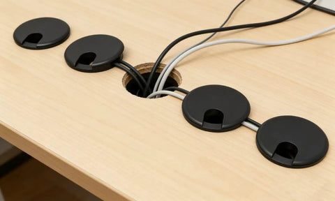 Premium Desktop Grommet Covers Slick Cable Organizers Hella Tough ABS Plastic Wire Routing Kit For Working From Home Office Setup No Mess Cord Management 5 Pack Black Two Point Five Inch Opening Sweet Fit Design on a wooden desk hiding cables.